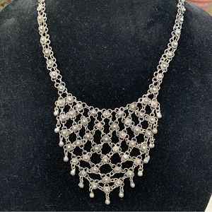 Silver bib necklace with floral, bead theme